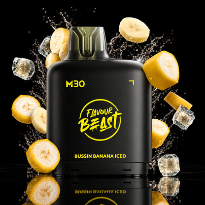 A black vape device labeled 'M30' and 'Flavour Beast' with 'Bussin Banana Iced' text, surrounded by floating banana slices, ice cubes, and golden light effects on a dark background.