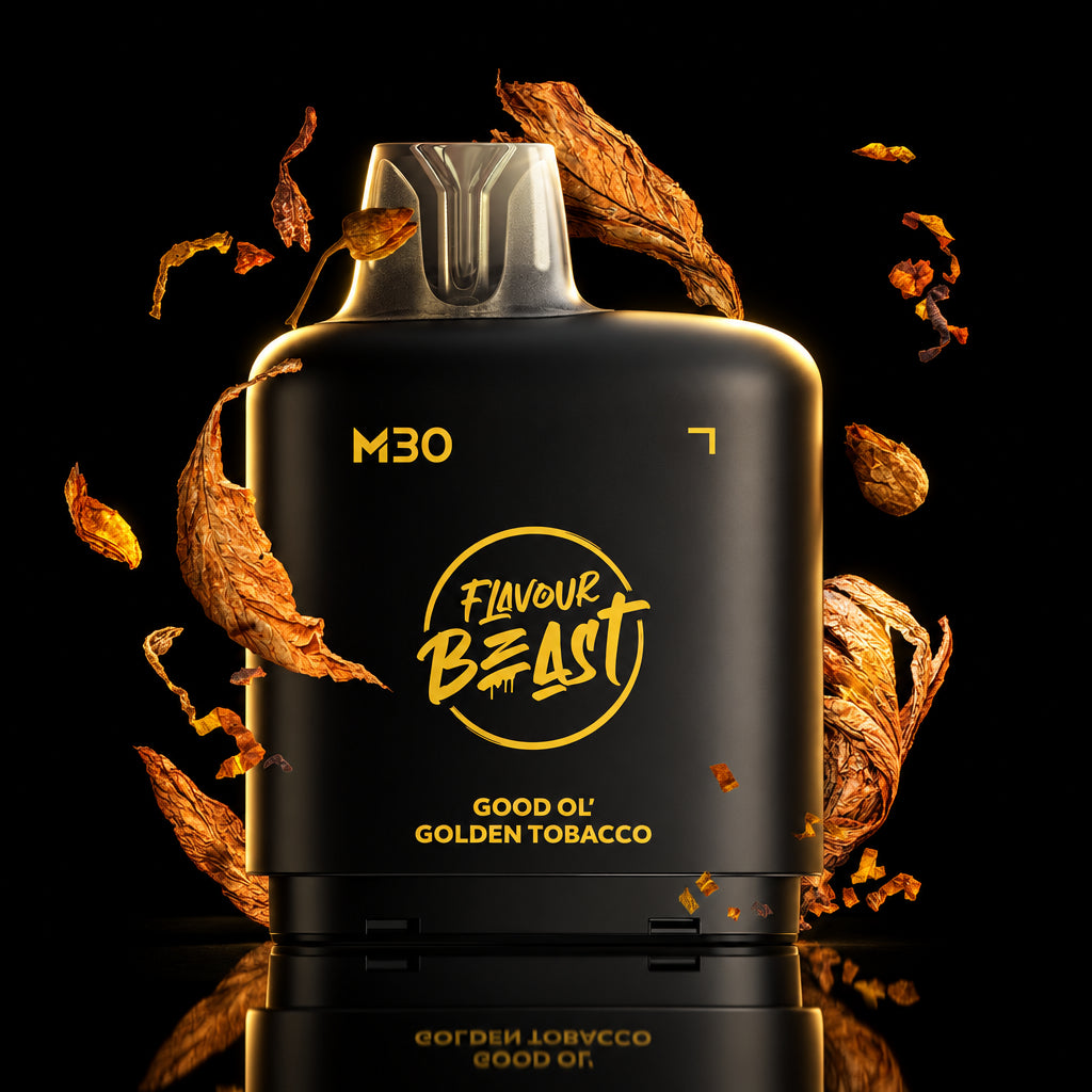 A dark metallic vape device labeled 'M30' and 'Flavour Beast Good Ol Golden Tobacco' is centered against a dramatic black background with glowing gold geometric lines and floating dried tobacco leaves.